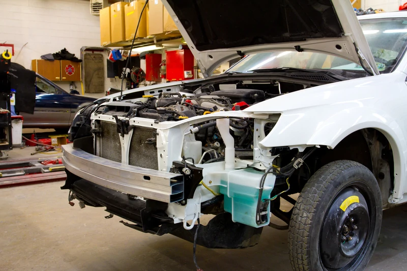 vehicle being repaired at a body shop after a collision