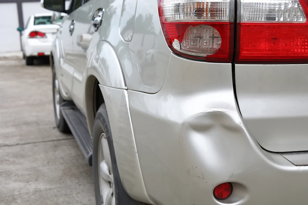 Dented rear bumper needing auto body repair in Lewisville TX